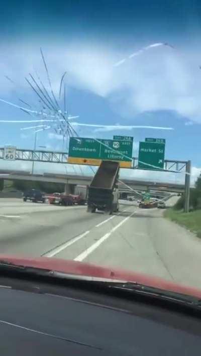 To warn the truck driver their dump trailer was up