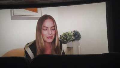 Attending a Live IMAX screening of Amsterdam, Margot zoomed in from London