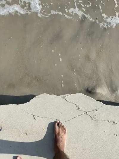 The way the sand cracks and falls