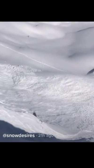 Snowboarder barely escapes the grips of a deadly avalanche