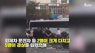 Car takes out scooter in Busan KR intersection.