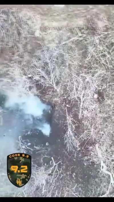 CODE 9.2 drone operators hits Russian soldier in face with dropped grenade before it explodes sending him flying to other side of trench.