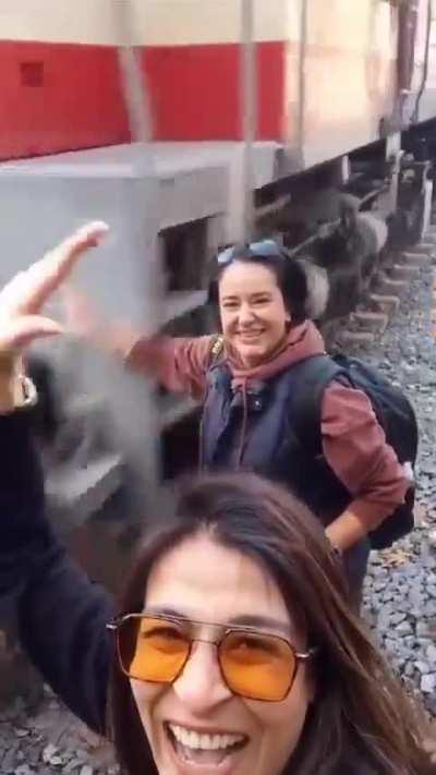 Holding your hand in front of a train