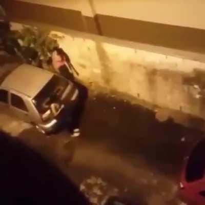 Having a piss in an alleyway