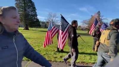 Feral woman spits all over media while screeching about masks and hoaxes