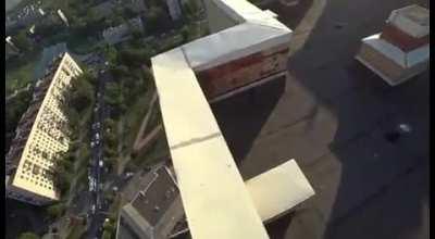 Man doing parkour almost fell off building