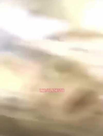 Trying to hold the belt.