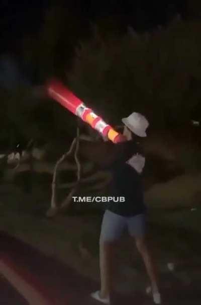 Shooting fireworks from a traffic pylon
