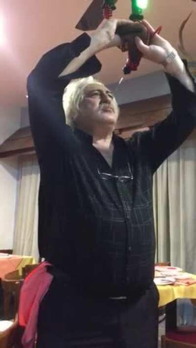 Abuelito singing while drinking wine