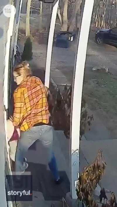 Mama handling a mad racoon.