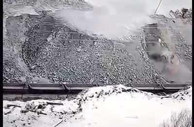 Mega-truck tips backwards and falls down stone cliff