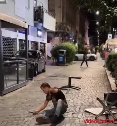 In Naples, a man carrying a knife is overpowered by a bar customer and then arrested by the police.