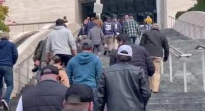 Seattle Police, discharged for noncompliance with the vaccine mandate, turn in their boots at the city hall rather than do the right thing to protect their community