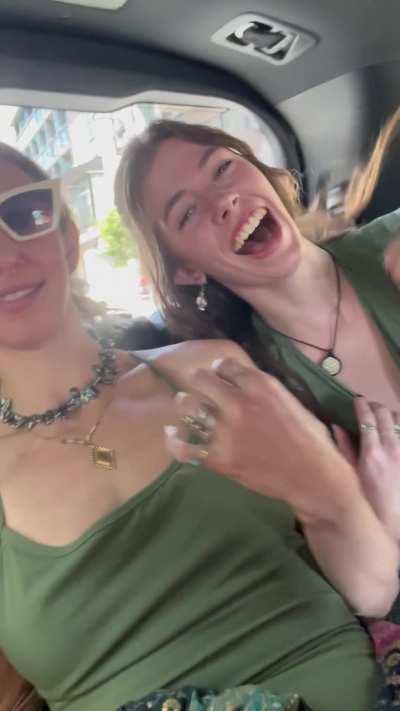 Having fun in the back of a full taxi