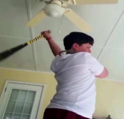kid breaks lamp with baseball bat