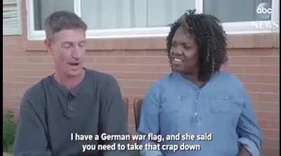 Man removes swastika sign for the friendship between him and a black officer