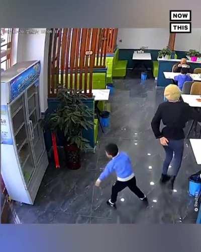 Kid shoves a server and yanks open fridge doors to receive some instant karma.