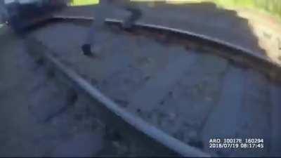 Officer Kyle Savoia saves a man from getting hit by a train with seconds to spare [USA]