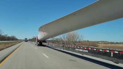 Transporting a single blade from a wind turbine in Iowa.