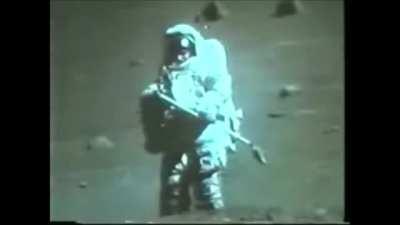 A rare glimpse of the face of an astronaut during a moon EVA (wait for zoom in). Apollo 17's LMP Harrison 