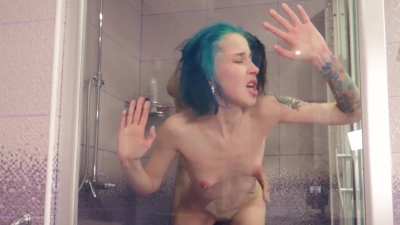 Pretty in blue pressed against the shower glass