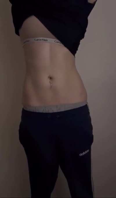 She is struggling to take off her hoodie without exposing herself…