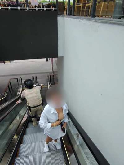 The security guy busted me when we got to the end of the escalator