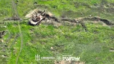 A drone of the Rubizh brigade spotted a Russian piling up TM-62 mines next to a destroyed tank and decided to destroy the pile.