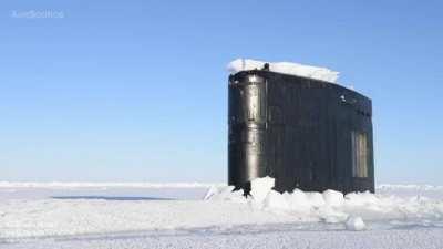 Nuclear submarine breaking through Arctic ice