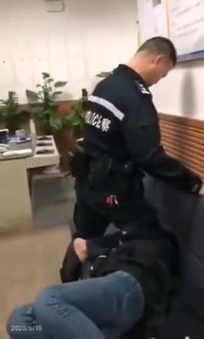 Police officer takes a knee