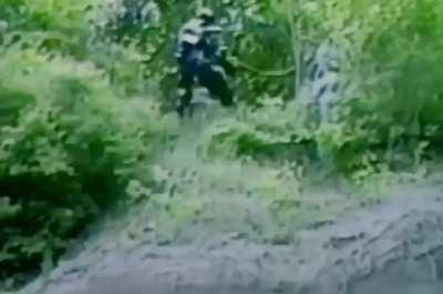 Canadian inventor tests his bear protection suit.