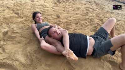 Applying headscissor squeeze to take down a man twice her size - kinksports.com