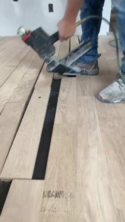 This guy putting in wood flooring