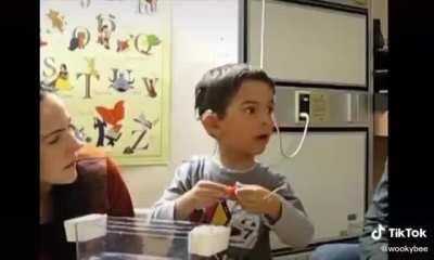 when first time a cute kid heard something then his reaction