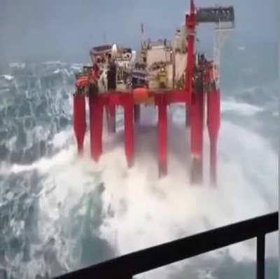 Oil rig swaying in the waves