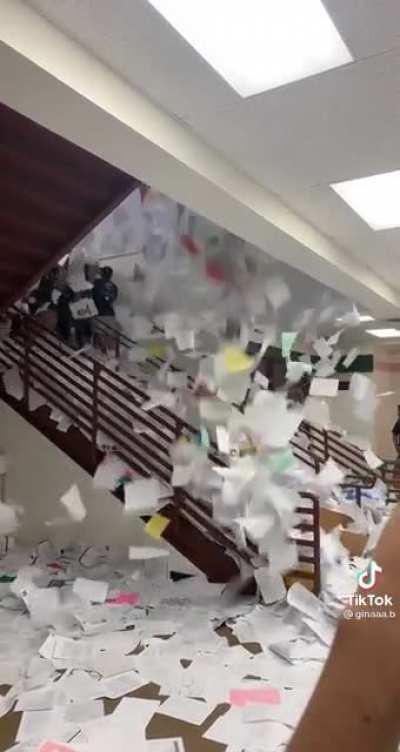 Graduating class of 2021 does a papertoss