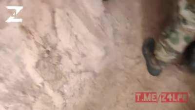 Ru pov: Russian soldiers loading tear gas grenade onto a drone and allegedly dropping it on a Ukrainian soldier in a trench (Video on the phone is unclear) source- Z4