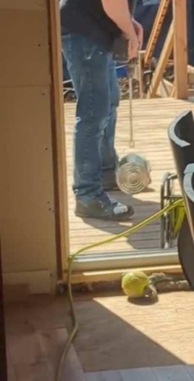 Using your custom made mixture to stir the paint