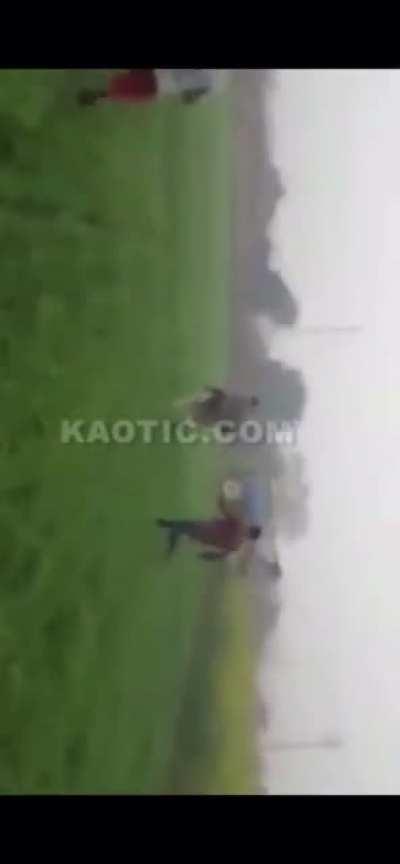 Dumbass tries to show off on a tractor. It nearly squashes him. The throttle gets stuck resulting in a bunch of other dumbasses chasing it trying to stop it.