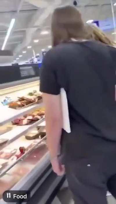 A bunch of Vegan/Vegetarian activists put a red flower on meats to morn their death.