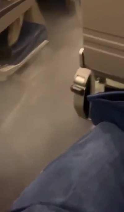 Fog in the aisle of a plane