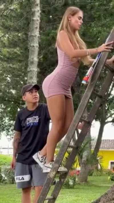 Beautiful Blonde Climbs Stairs in a skirt and teases men