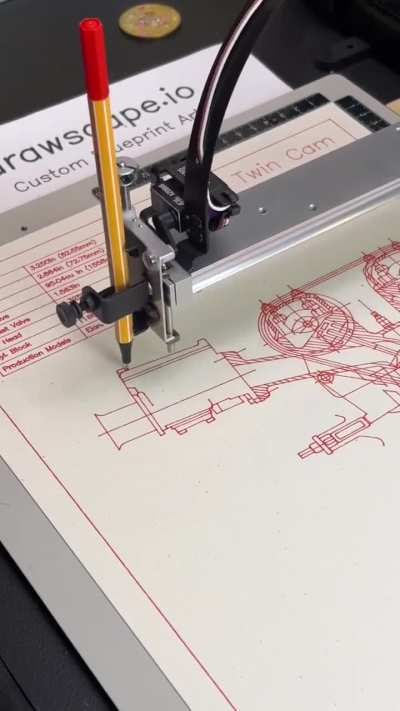 Robot drawing an engine blueprint.