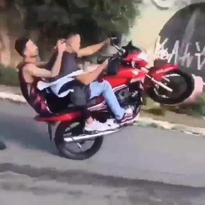 Cutting hair while doing a wheelie