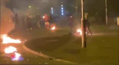Throwing petrol bombs at police vehicles