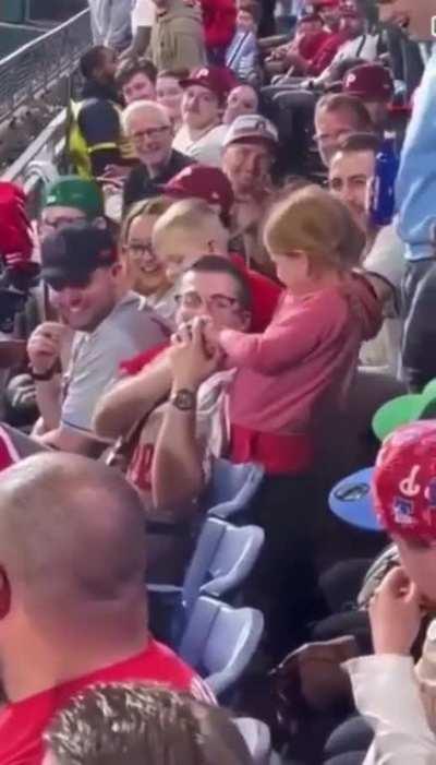 Kid steals random guys baseball and parents force her to throw it on the field