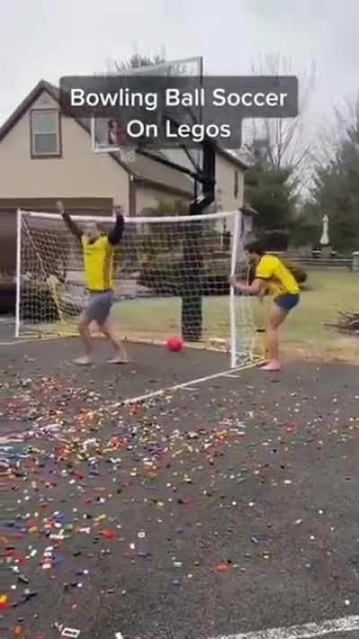 Playing bowling ball soccer on legos