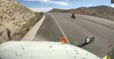 Truck collides with motorcycle head on
