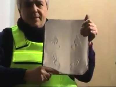 Idiot demonstrating a bulletproof vest