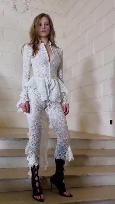 hunter schafer posing for photos at the jean paul gaultier haute couture runway.